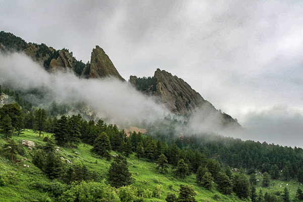 Flatirons in fog by Evan Lambrecht